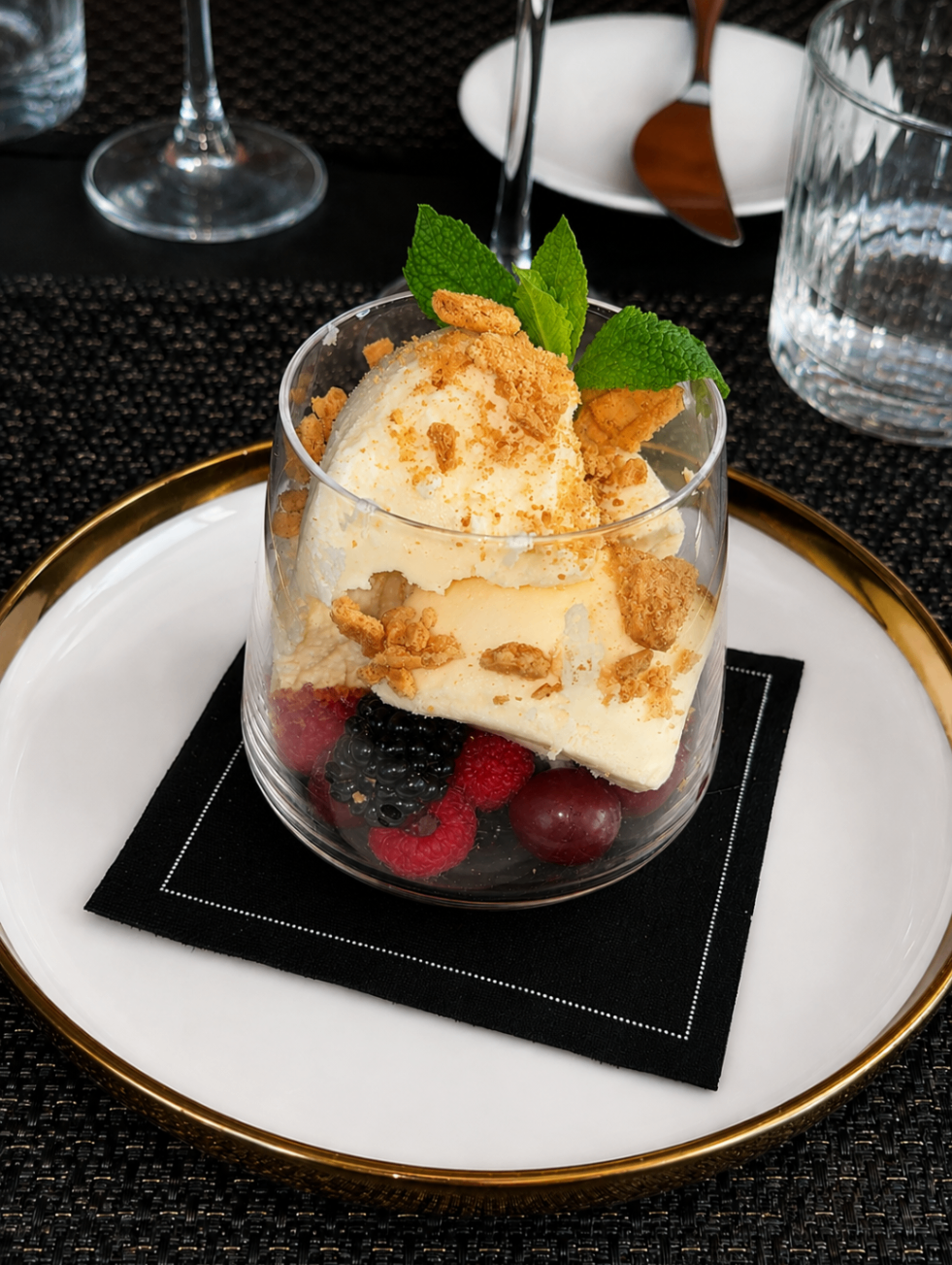 Individual berry parfait dessert with mint